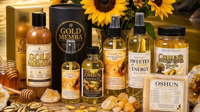 A styled product display for the Eclectic Faith Botanica & Wellness Oshun Ritual Collection, featuring multiple amber bottles, a honey jar, crystals, sunflowers, and candles arranged on a gold-leaf-covered surface with a dark tropical forest background.